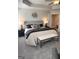 Main bedroom suite featuring a sitting area with a bench and access to a private bathroom at 256 Epping Drive, Stockbridge, GA 30281