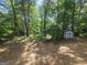 Wooded backyard with storage shed at 367 Frashier Rd, Carrollton, GA 30116