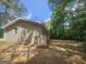 Exterior side view of a brick home surrounded by trees at 367 Frashier Rd, Carrollton, GA 30116