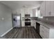 Kitchen featuring stainless appliances, granite countertops, and ample cabinetry at 367 Frashier Rd, Carrollton, GA 30116