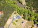 Beautiful aerial view of a house with surrounding mature trees, landscaping and a lakeside location at 637 Lakeview Dr, Newborn, GA 30056