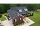 Aerial view of the home displaying the roof and front porch, landscaping, and long driveway at 637 Lakeview Dr, Newborn, GA 30056