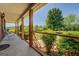 An outdoor deck with railings overlooks a green lawn and a wooded area at 637 Lakeview Dr, Newborn, GA 30056