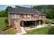 Expansive backyard with a multi-tiered deck, patio, and lush lawn, perfect for outdoor entertaining and relaxation at 637 Lakeview Dr, Newborn, GA 30056