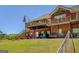 Spacious backyard featuring a multi-level deck and patio, ideal for outdoor activities and enjoying the serene surroundings at 637 Lakeview Dr, Newborn, GA 30056