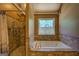 This bathroom features a jetted tub and tiled shower at 637 Lakeview Dr, Newborn, GA 30056