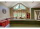 Charming dining room with vaulted ceilings, large windows, and views to the outside at 637 Lakeview Dr, Newborn, GA 30056