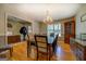 Dining room with hardwood floors, overhead lighting, and a view of the home's entryway at 637 Lakeview Dr, Newborn, GA 30056