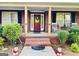 A cozy front porch with brick steps and classic columns framing the inviting entrance at 637 Lakeview Dr, Newborn, GA 30056