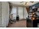 This is a home office featuring built in shelves, and a rocking chair for a cozy workspace at 637 Lakeview Dr, Newborn, GA 30056