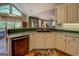 This kitchen showcases an island, stainless steel dishwasher, and great views at 637 Lakeview Dr, Newborn, GA 30056