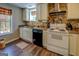 View of the kitchen showcasing a window and white cabinetry at 637 Lakeview Dr, Newborn, GA 30056