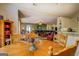 Open-concept living room with view to the kitchen and leather furniture at 637 Lakeview Dr, Newborn, GA 30056