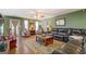 Cozy living room with hardwood floors, comfortable seating, and natural light at 637 Lakeview Dr, Newborn, GA 30056