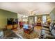 Spacious living area with hardwood floors, a ceiling fan, and ample seating at 637 Lakeview Dr, Newborn, GA 30056