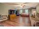 Cozy living area features wood floors, comfortable seating, and large-screen television for relaxing entertainment at 637 Lakeview Dr, Newborn, GA 30056