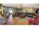Comfortable living room featuring a large leather couch and wooden floors at 637 Lakeview Dr, Newborn, GA 30056