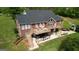 Beautiful brick home featuring a spacious deck and patio area, ideal for outdoor entertaining at 637 Lakeview Dr, Newborn, GA 30056