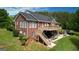 Back of a brick house with a dual-level deck, spacious backyard, and partial fencing at 637 Lakeview Dr, Newborn, GA 30056