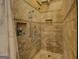Tiled shower with a built-in niche and overhead shower-head at 637 Lakeview Dr, Newborn, GA 30056
