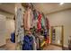 Bright walk-in closet featuring wire shelving and wood-look flooring providing ample storage for clothing and accessories at 637 Lakeview Dr, Newborn, GA 30056