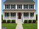 Charming two-story home with a welcoming front porch, beautiful lawn, and a classic design at 101 Warmstone Path, Peachtree City, GA 30269