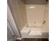 Bathroom features a white tub and shower at 120 Lazy Hollow Ln, Covington, GA 30016