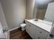 Bathroom features white vanity with a large mirror at 120 Lazy Hollow Ln, Covington, GA 30016