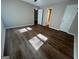 Bedroom with hardwood floors and a view to hallway and closet at 120 Lazy Hollow Ln, Covington, GA 30016