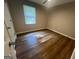 Small bedroom with hardwood floors and natural light at 120 Lazy Hollow Ln, Covington, GA 30016
