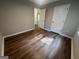 Bedroom featuring wood floors and multiple doorways at 120 Lazy Hollow Ln, Covington, GA 30016