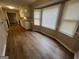 Bright dining area with new floors and natural light, nestled next to a well-equipped kitchen at 120 Lazy Hollow Ln, Covington, GA 30016