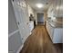Bright kitchen features white cabinets, granite countertops, and stainless steel appliances at 120 Lazy Hollow Ln, Covington, GA 30016