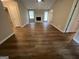 Bright living room with a white brick fireplace, wood flooring, and a ceiling fan for added comfort at 120 Lazy Hollow Ln, Covington, GA 30016
