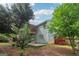 View of backyard featuring the home's siding, outdoor deck, and patio at 1152 Sunday Ln, Jonesboro, GA 30238