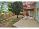View of backyard featuring a concrete patio and wooden deck connected to the upper floor of the house at 1152 Sunday Ln, Jonesboro, GA 30238