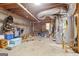 Storage basement with exposed ductwork and utilities surrounded by various stored items at 1152 Sunday Ln, Jonesboro, GA 30238