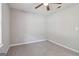 Simple bedroom with a neutral color palette, ceiling fan, and a window for natural light at 1152 Sunday Ln, Jonesboro, GA 30238