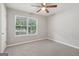 Well-lit bedroom featuring a ceiling fan and a large window offering pleasant outdoor views at 1152 Sunday Ln, Jonesboro, GA 30238