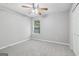 Bright bedroom featuring neutral walls, plush carpet, ceiling fan and a sun-filled window at 1152 Sunday Ln, Jonesboro, GA 30238