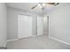 Cozy bedroom with fresh paint, carpet floors, closet, and an open doorway at 1152 Sunday Ln, Jonesboro, GA 30238