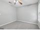 Standard bedroom features neutral walls, carpet, ceiling fan and natural light from the window at 1152 Sunday Ln, Jonesboro, GA 30238