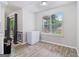 Bright dining area with wood floors, large window, and neutral paint tones at 1152 Sunday Ln, Jonesboro, GA 30238