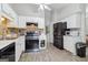 Functional kitchen features appliances, white cabinets, and vinyl floors at 1152 Sunday Ln, Jonesboro, GA 30238