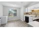 Kitchen with wood floors, bright window, and white cabinets at 1152 Sunday Ln, Jonesboro, GA 30238