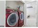 Laundry room with dual washer and dryer machines and overhead shelving at 1152 Sunday Ln, Jonesboro, GA 30238