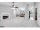 Spacious living room view including the fireplace, dining area, laundry area, and open floorplan at 1152 Sunday Ln, Jonesboro, GA 30238
