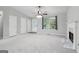 Bright living room featuring a fireplace, neutral tones, and a ceiling fan for added comfort at 1152 Sunday Ln, Jonesboro, GA 30238