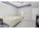 Light-filled main bedroom with neutral colors and recessed tray ceiling at 1152 Sunday Ln, Jonesboro, GA 30238