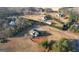 Picturesque home features a tree-lined yard, surrounded by neighboring homes and wooded boundaries, offering privacy and community at 4180 Mount Paran Dr, Social Circle, GA 30025